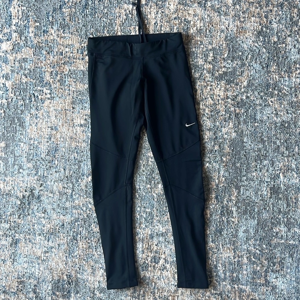 Like new Nike running pants with zippers and reflective bands